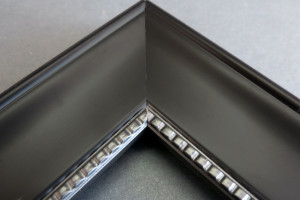 black studded picture frame straight on